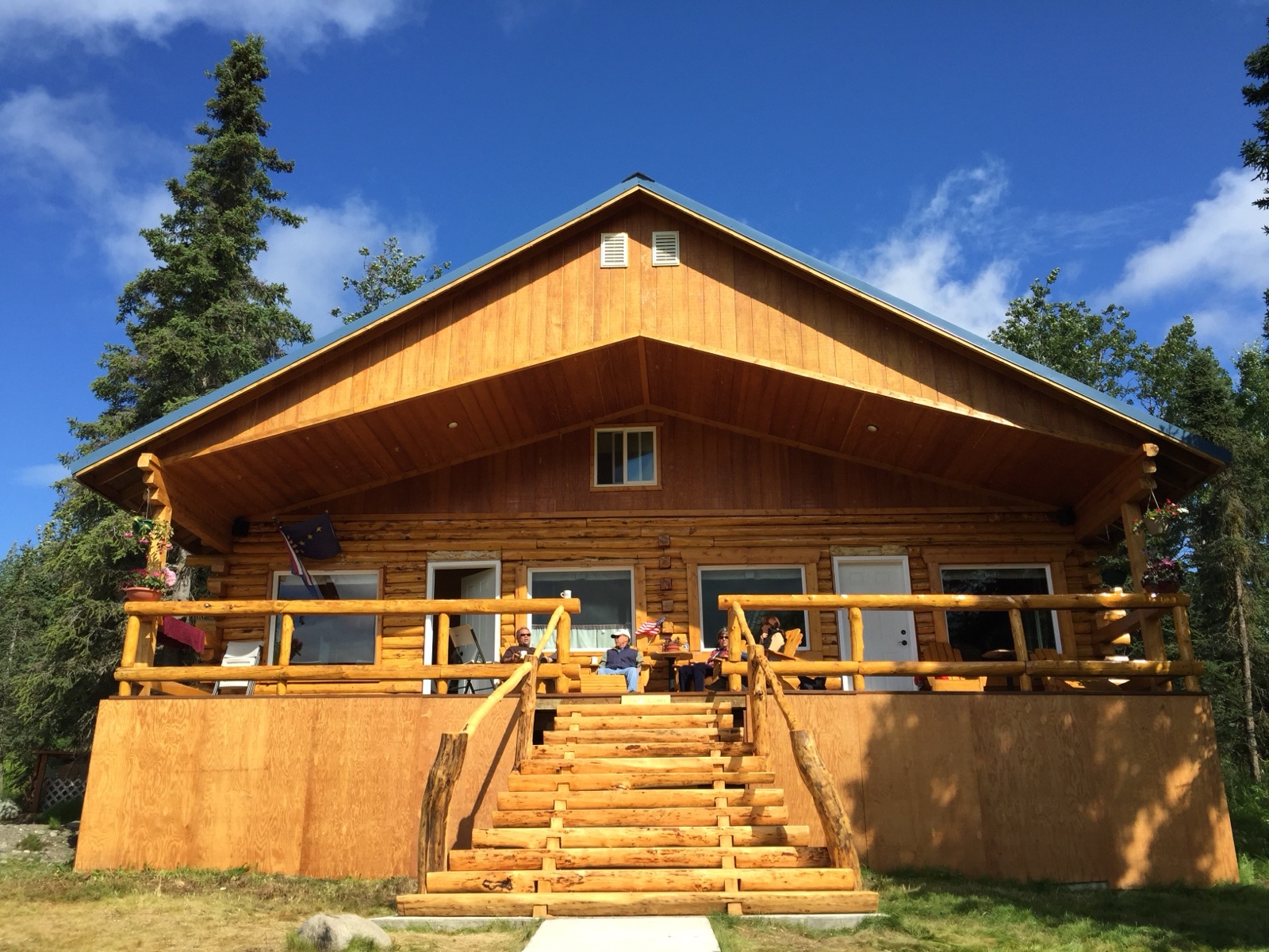The Riverfront Lodge, front porch at golden hour